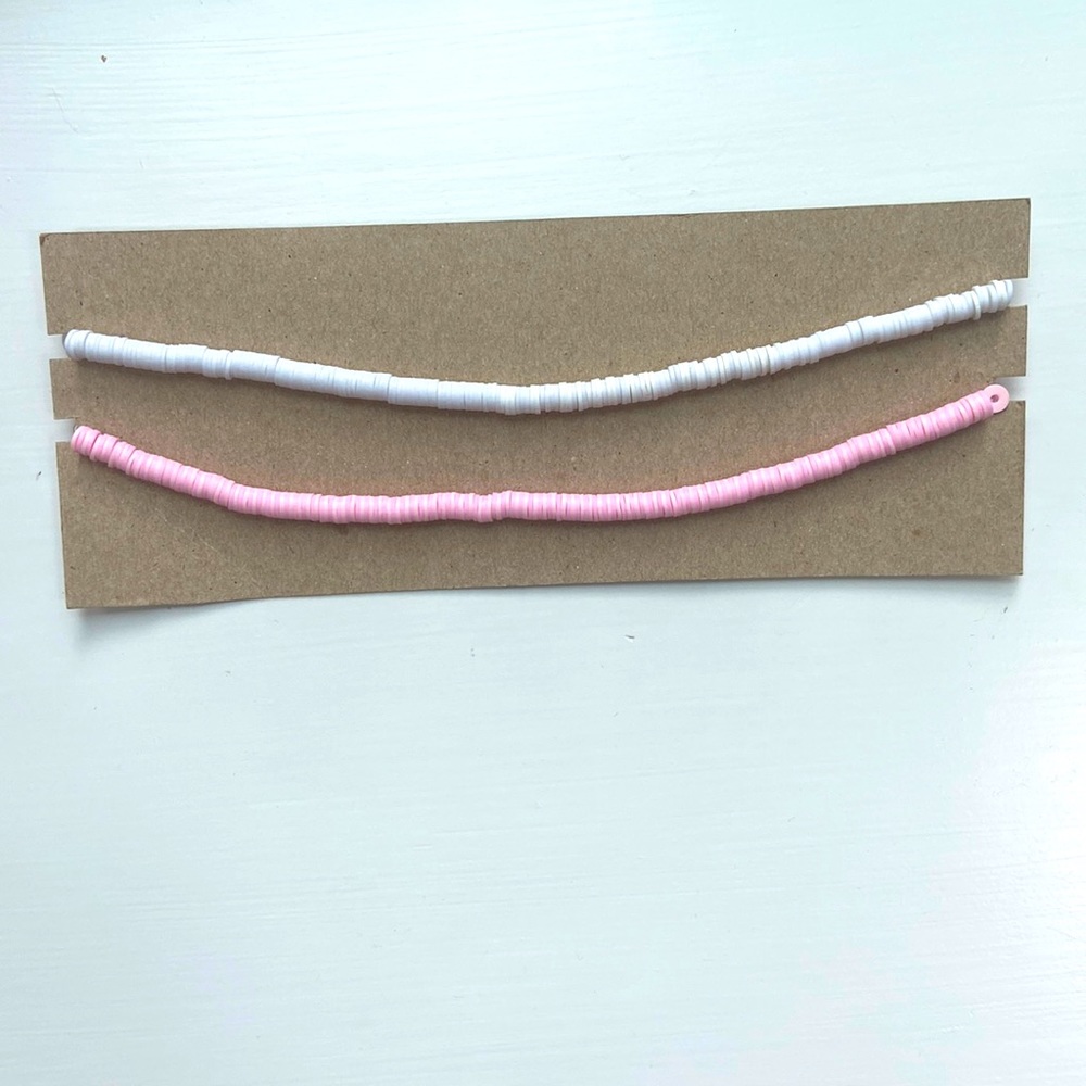 2 set of clay disc bead necklaces, light pink and white with gold chain.